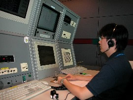 Aeronautical Communications Officer broadcasts meteorological information to aircraft in flight
