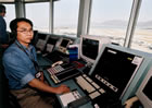 Air traffic controller performing his duty at the aerodrome tower.