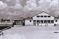 The old Kai Tak Terminal Building was demolished in 1965. The new Terminal Building in the background
