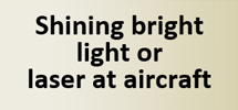 Shining Bright light or laser at aircraft